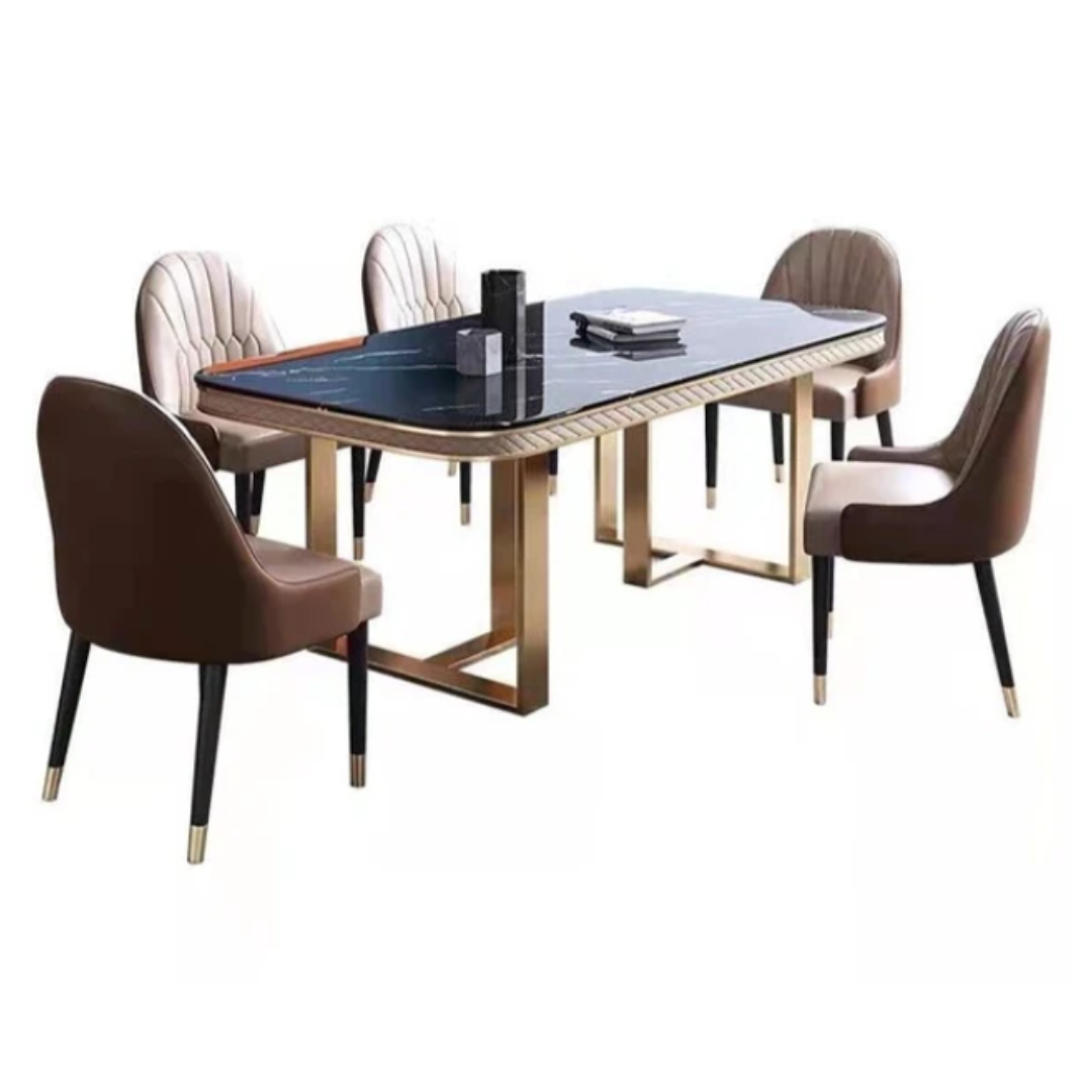 The Luxury Black Marble Dining Table Set is a masterpiece of modern elegance and timeless design. It features a premium black marble tabletop that exudes luxury, beautifully supported by a rectangular stainless steel base in a gold finish that adds a glamorous touch. The contrast of dark marble with gleaming gold metal creates a dramatic yet refined look — ideal for upscale interiors. This dining set is crafted not just for beauty but also for durability, making it perfect for both everyday dining and special occasions. The table is available with matching upholstered or leatherette chairs, and customization options are offered for marble tone, frame finish, and chair style, allowing you to personalize it to suit your space perfectly.7