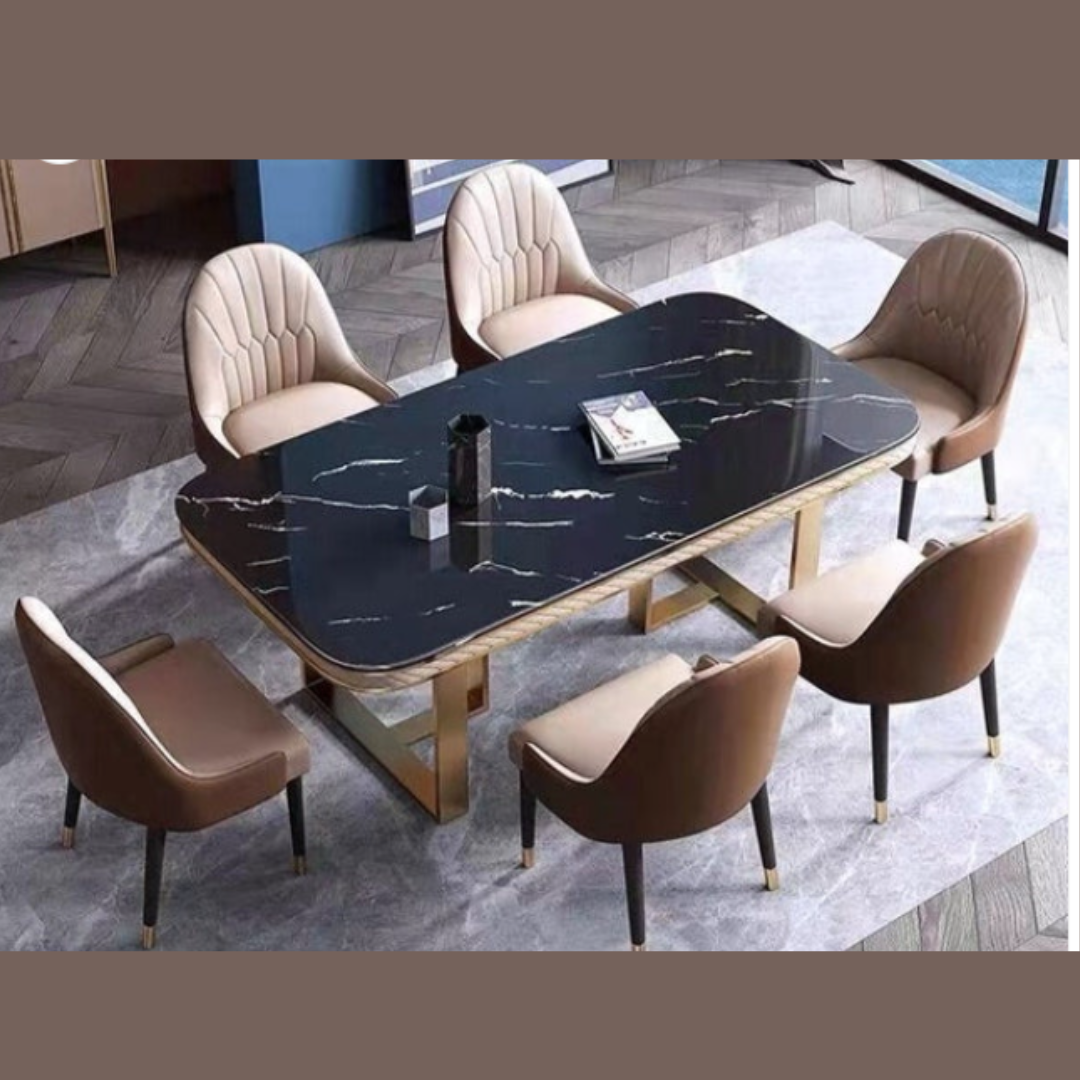 The Luxury Black Marble Dining Table Set is a masterpiece of modern elegance and timeless design. It features a premium black marble tabletop that exudes luxury, beautifully supported by a rectangular stainless steel base in a gold finish that adds a glamorous touch. The contrast of dark marble with gleaming gold metal creates a dramatic yet refined look — ideal for upscale interiors. This dining set is crafted not just for beauty but also for durability, making it perfect for both everyday dining and special occasions. The table is available with matching upholstered or leatherette chairs, and customization options are offered for marble tone, frame finish, and chair style, allowing you to personalize it to suit your space perfectly.5