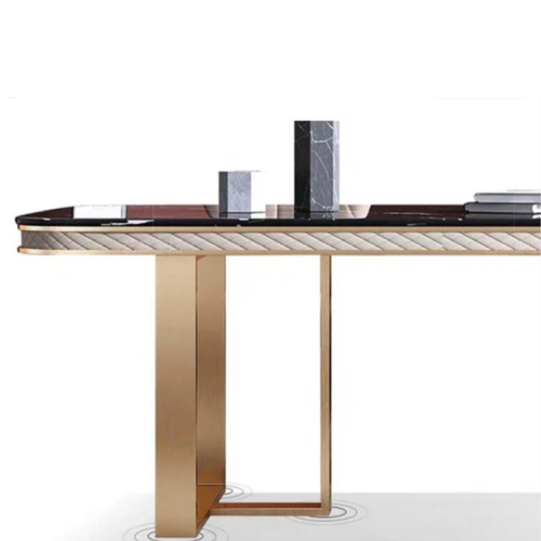 The Luxury Black Marble Dining Table Set is a masterpiece of modern elegance and timeless design. It features a premium black marble tabletop that exudes luxury, beautifully supported by a rectangular stainless steel base in a gold finish that adds a glamorous touch. The contrast of dark marble with gleaming gold metal creates a dramatic yet refined look — ideal for upscale interiors. This dining set is crafted not just for beauty but also for durability, making it perfect for both everyday dining and special occasions. The table is available with matching upholstered or leatherette chairs, and customization options are offered for marble tone, frame finish, and chair style, allowing you to personalize it to suit your space perfectly. 2